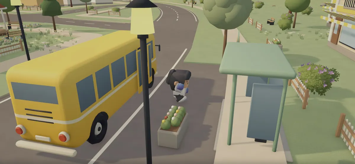 Żółty autobus stoi na przystanku w miasteczku.
